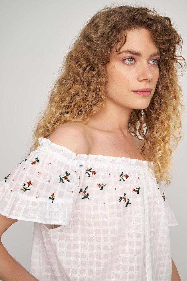 Embroidered ruffle top on sale